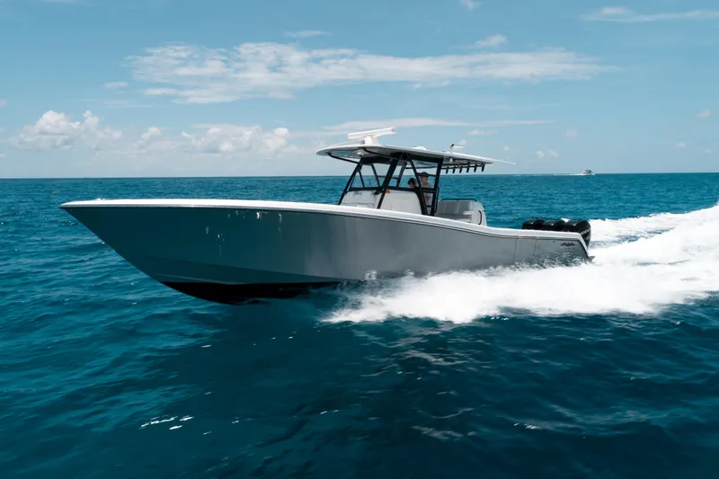  Yacht Photos Pics 2020 Invincible 39 Open Fisherman boat cruising on open ocean waters.