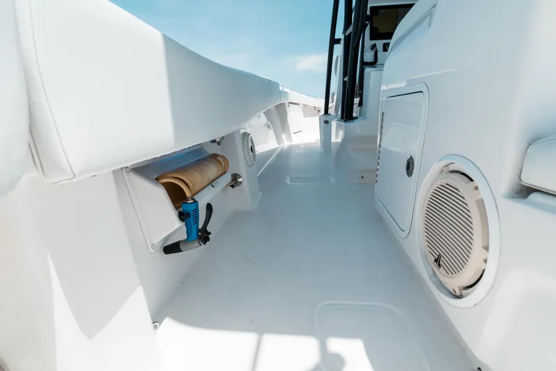  Yacht Photos Pics 2020 Invincible 39 Open Fisherman boat interior with storage and speaker.