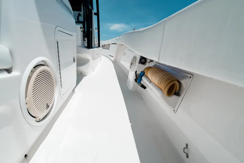  Yacht Photos Pics 2020 Invincible 39 Open Fisherman boat deck with storage compartments.