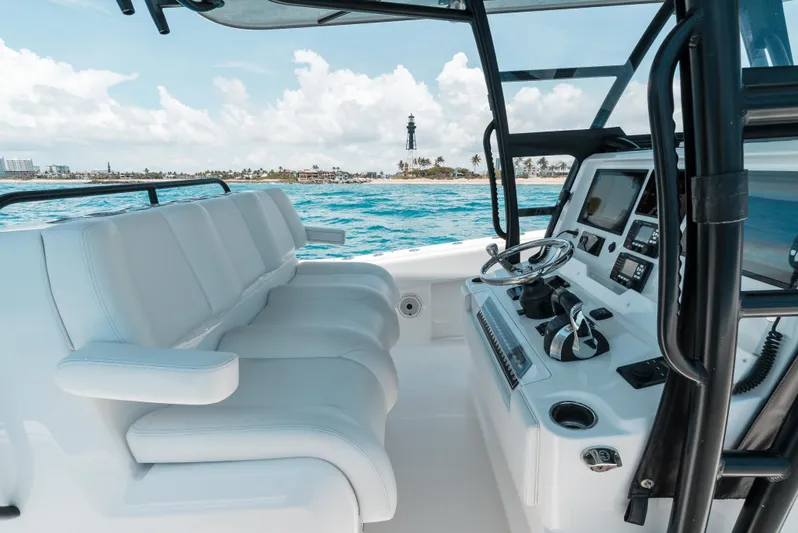  Yacht Photos Pics 2020 Invincible 39 Open Fisherman boat interior with helm and seating, ocean view.