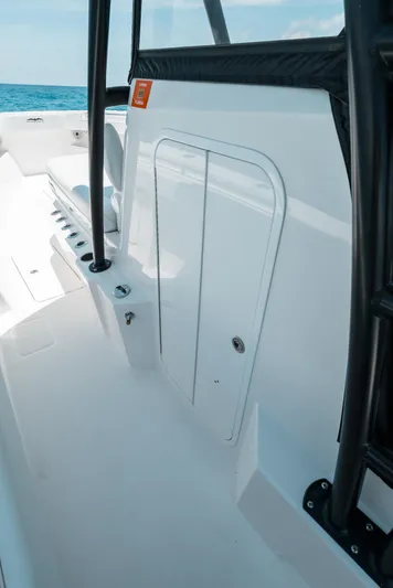  Yacht Photos Pics 2020 Invincible 39 Open Fisherman boat interior with storage compartment and rod holders.