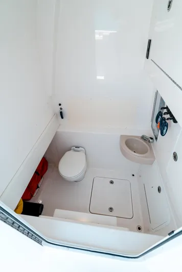  Yacht Photos Pics 2020 Invincible 39 Open Fisherman boat interior with toilet and sink.