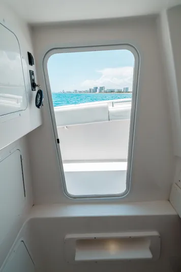  Yacht Photos Pics View from inside a 2020 Invincible 39 Open Fisherman boat, overlooking the ocean and city skyline.