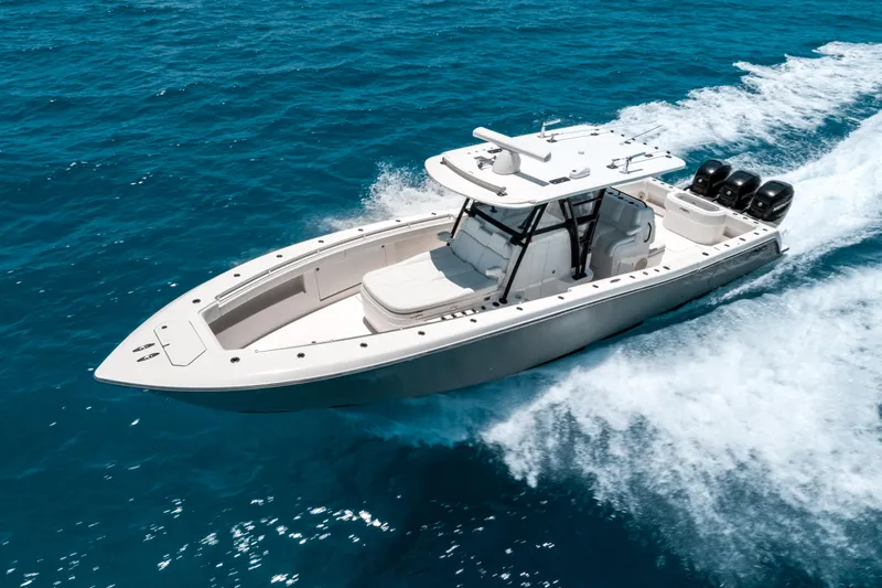  Yacht Photos Pics 2020 Invincible 39 Open Fisherman cruising on blue ocean waters.