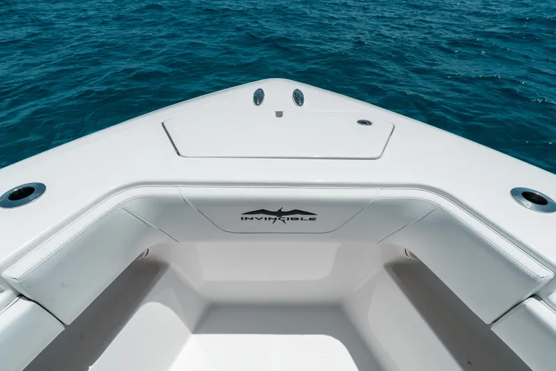  Yacht Photos Pics 2020 Invincible 39 Open Fisherman boat on blue ocean water.