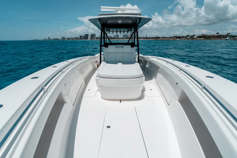  Yacht Photos Pics 2020 Invincible 39 Open Fisherman boat on open water, clear sky, coastal view.