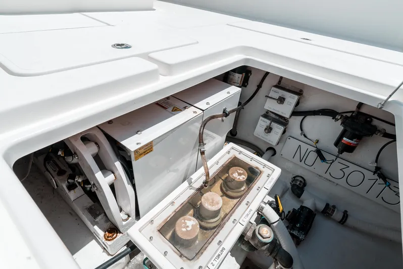  Yacht Photos Pics Engine compartment of 2020 Invincible 39 Open Fisherman boat, showcasing mechanical components.
