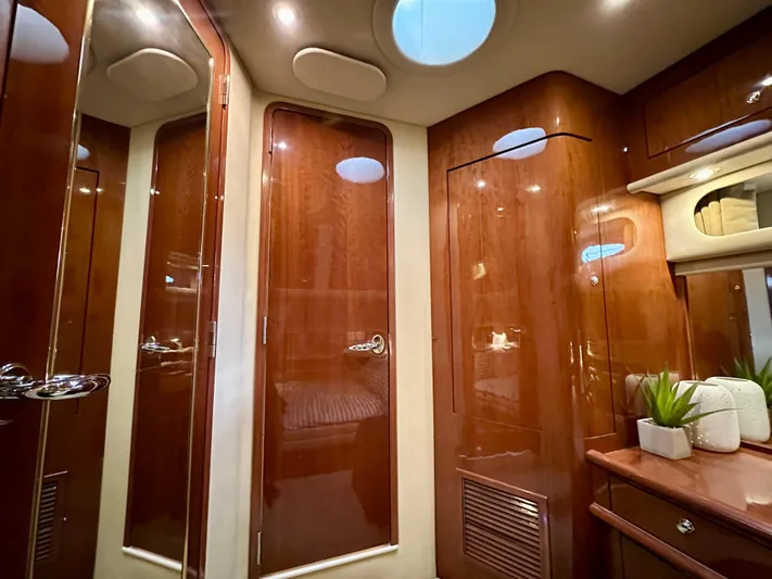 Slim Smitty Yacht Photos Pics Luxurious interior of 2002 Sea Ray 560 Sedan Bridge yacht with polished wood finishes.