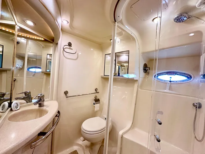 Slim Smitty Yacht Photos Pics Luxurious bathroom in 2002 Sea Ray 560 Sedan Bridge yacht with modern fixtures.