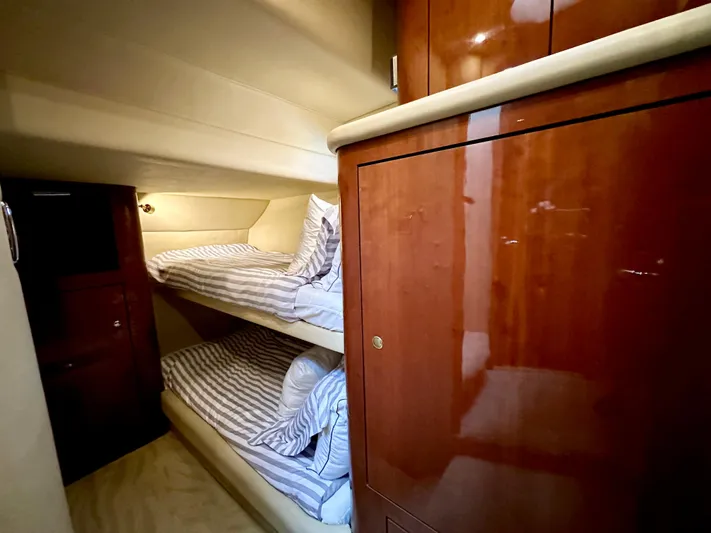 Slim Smitty Yacht Photos Pics 2002 Sea Ray 560 Sedan Bridge cabin with wooden cabinetry and bunk beds.