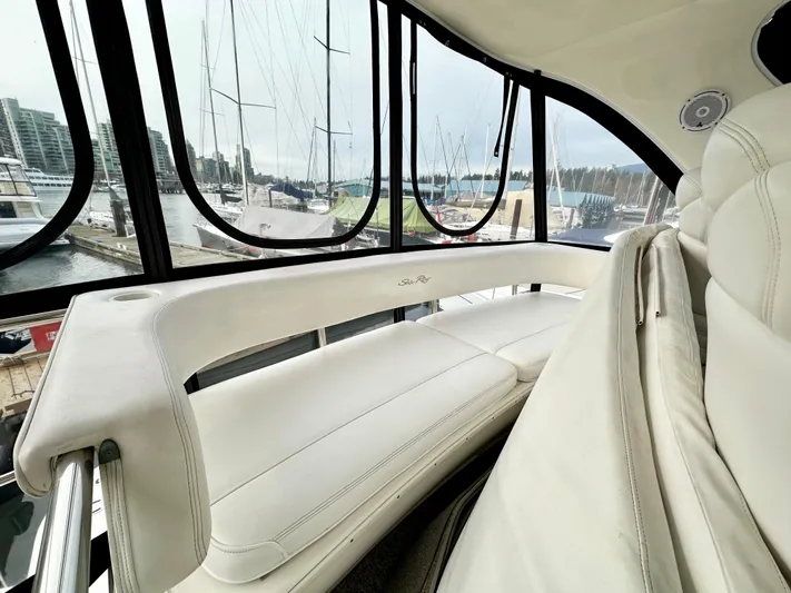 Slim Smitty Yacht Photos Pics 2002 Sea Ray 560 Sedan Bridge interior with white seating and marina view.