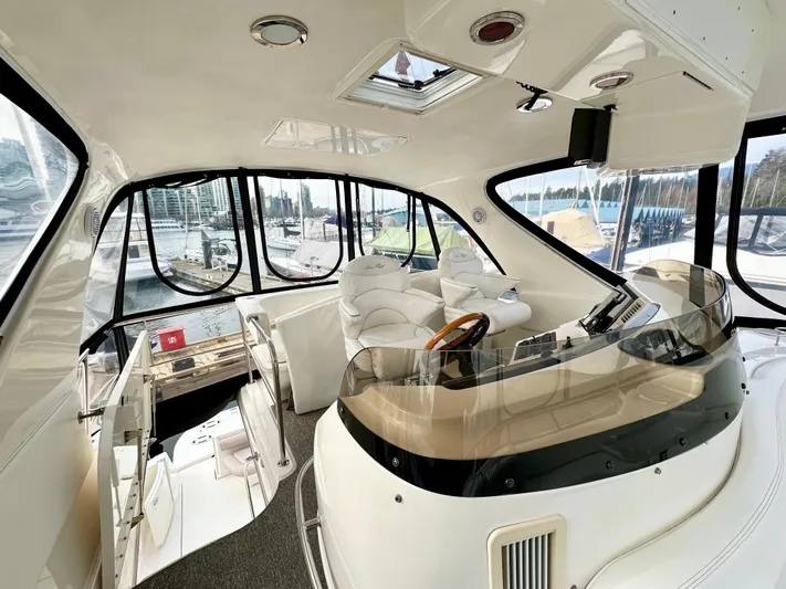 Slim Smitty Yacht Photos Pics Interior of 2002 Sea Ray 560 Sedan Bridge yacht with modern helm and seating.