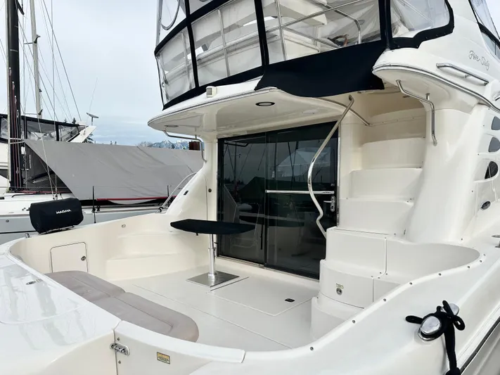 Slim Smitty Yacht Photos Pics 2002 Sea Ray 560 Sedan Bridge yacht with spacious deck and elegant design.