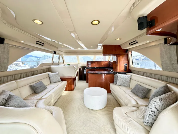 Slim Smitty Yacht Photos Pics Luxurious interior of a 2002 Sea Ray 560 Sedan Bridge yacht with elegant seating and modern design.