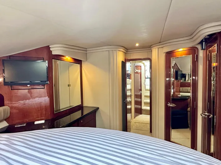 Slim Smitty Yacht Photos Pics Luxurious interior of 2002 Sea Ray 560 Sedan Bridge yacht with elegant wood finishes.