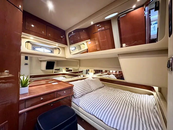 Slim Smitty Yacht Photos Pics Luxurious cabin interior of 2002 Sea Ray 560 Sedan Bridge yacht with elegant wood finishes.