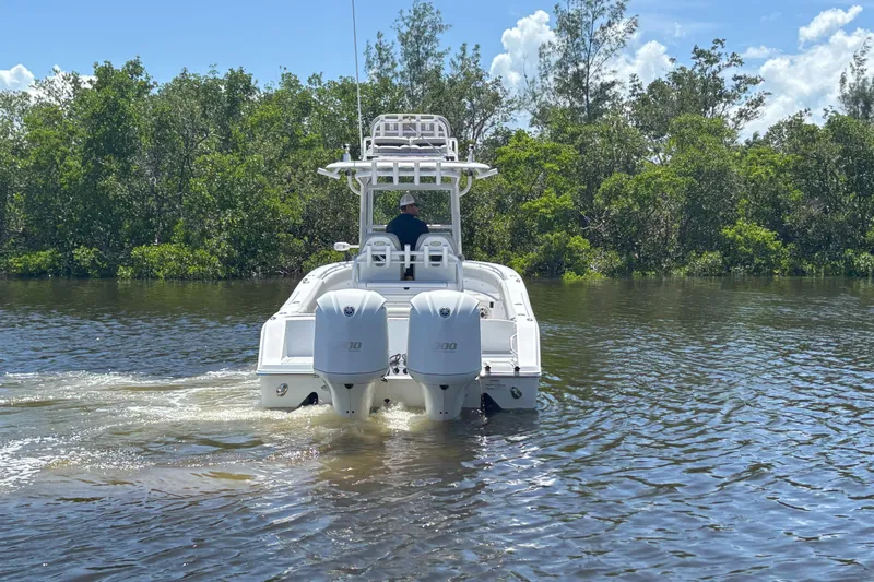  Yacht Photos Pics 2020 Sportsman Open 282 Center Console boat cruising on a sunny day.