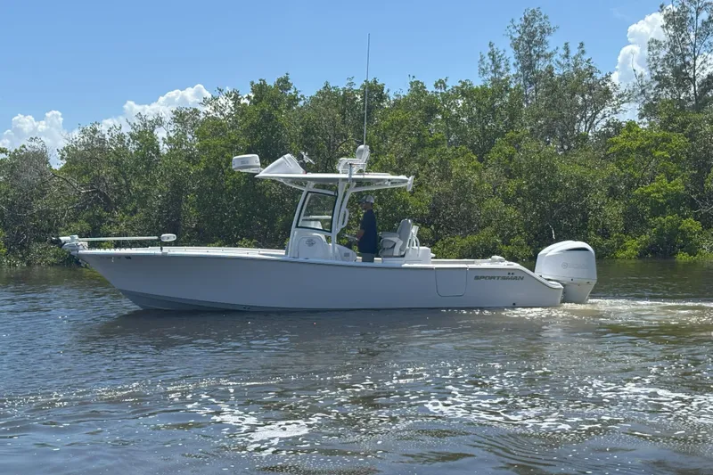  Yacht Photos Pics 2020 Sportsman Open 282 Center Console boat cruising on a sunny day.