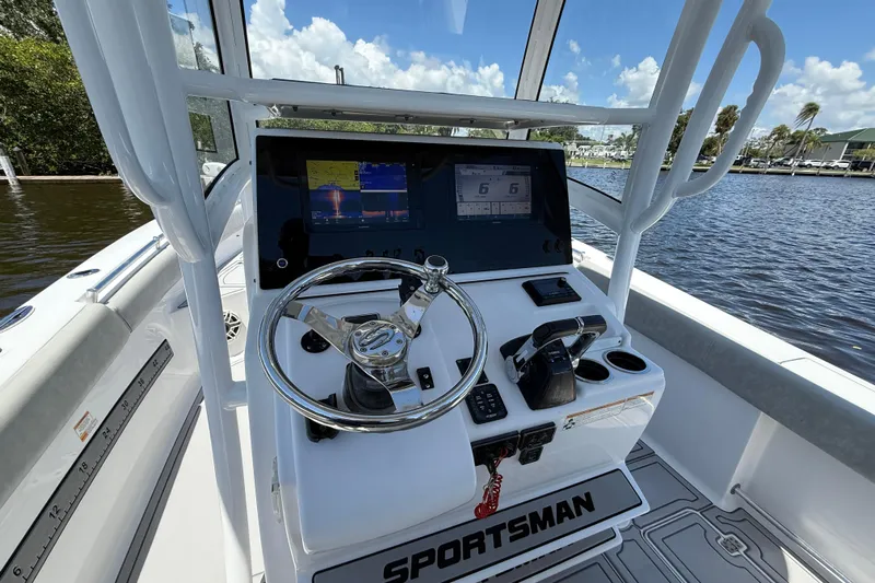  Yacht Photos Pics 2020 Sportsman Open 282 Center Console boat dashboard with steering wheel and navigation screens.