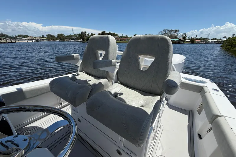 Yacht Photos Pics 2020 Sportsman Open 282 Center Console boat with plush seating on a sunny day.