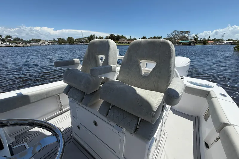  Yacht Photos Pics 2020 Sportsman Open 282 Center Console boat with plush seating on a sunny day.