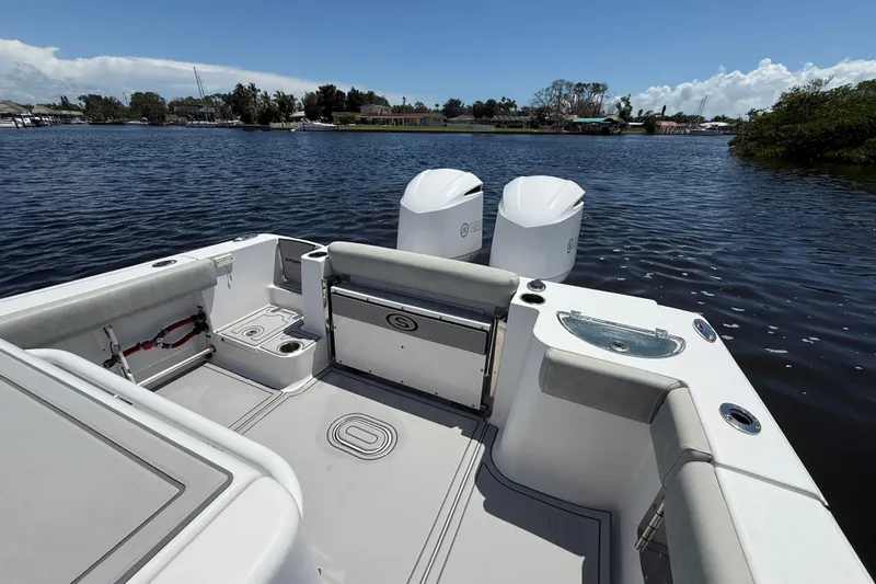  Yacht Photos Pics 2020 Sportsman Open 282 Center Console boat on calm water, featuring dual engines.