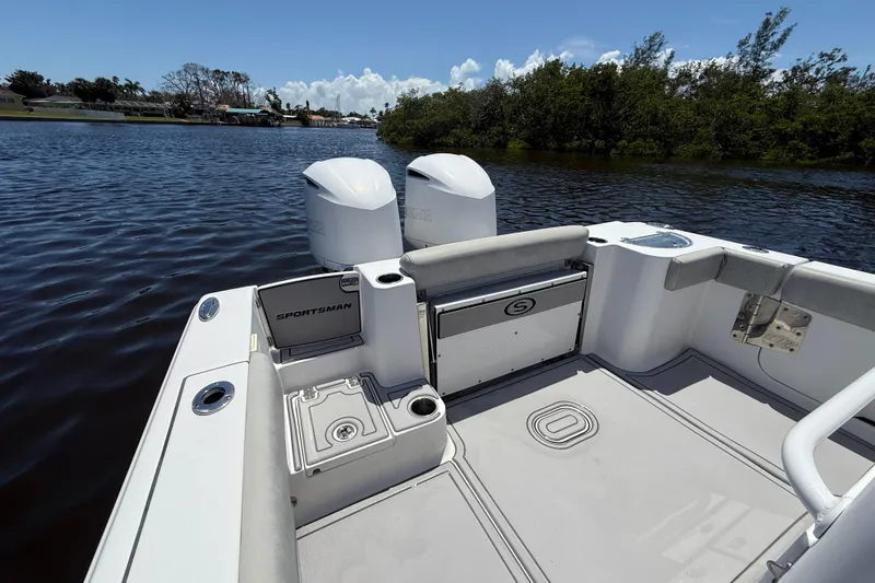  Yacht Photos Pics 2020 Sportsman Open 282 Center Console boat on calm water, featuring dual engines.
