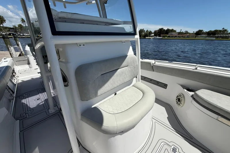  Yacht Photos Pics 2020 Sportsman Open 282 Center Console boat interior with seating, on a sunny day by the water.