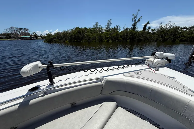  Yacht Photos Pics 2020 Sportsman Open 282 Center Console boat with trolling motor on calm water.