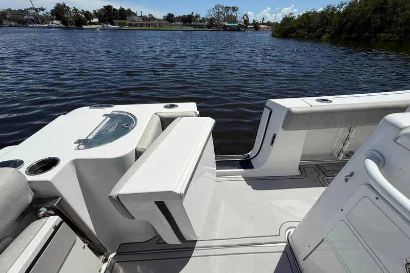  Yacht Photos Pics 2020 Sportsman Open 282 Center Console boat interior with seating and water view.