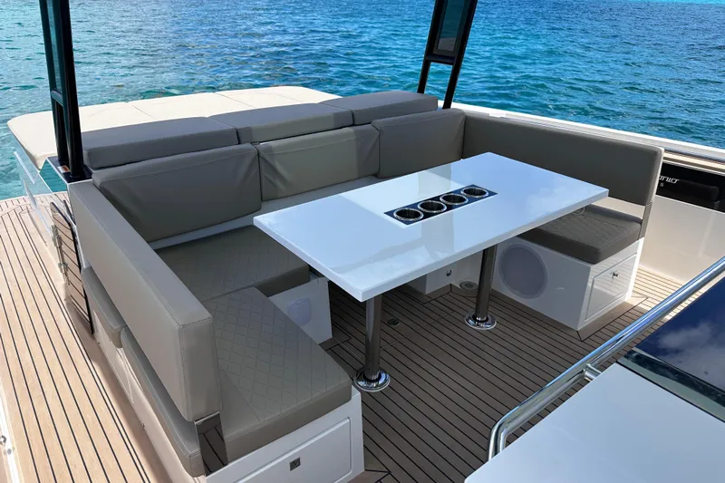 2025 Day 36 @ Cancun Yacht Photos Pics Luxurious seating area on 2025 De Antonio Yachts D36, featuring sleek design and ocean view.