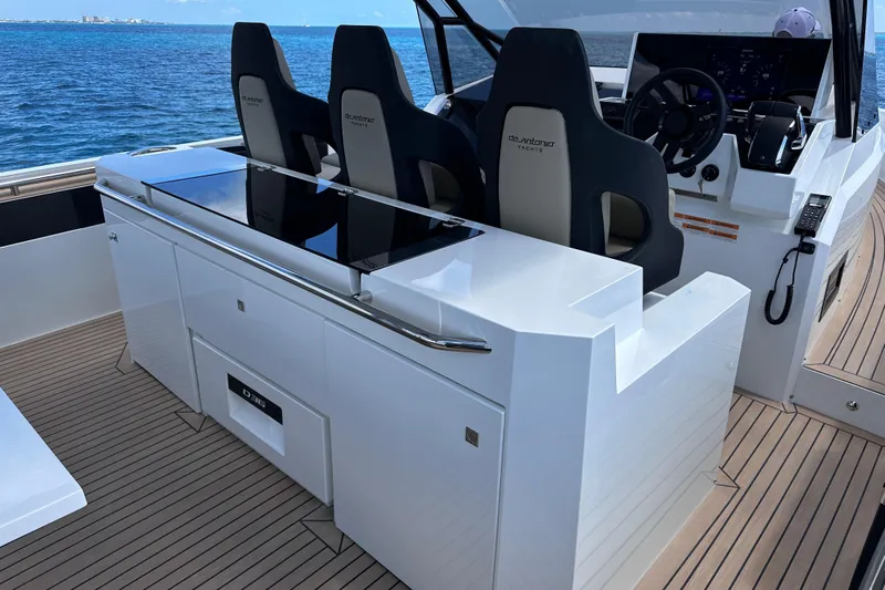 2025 Day 36 @ Cancun Yacht Photos Pics 2025 De Antonio Yachts D36 cockpit with sleek design and modern controls on open water.