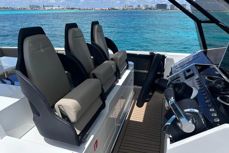 2025 Day 36 @ Cancun Yacht Photos Pics Luxury helm of 2025 De Antonio Yachts D36, featuring modern controls and seating.