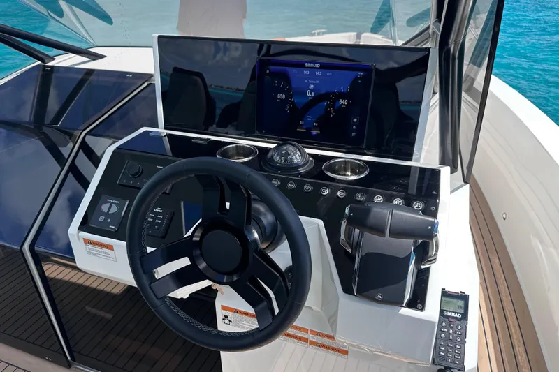2025 Day 36 @ Cancun Yacht Photos Pics 2025 De Antonio Yachts D36 helm with modern controls and navigation display.