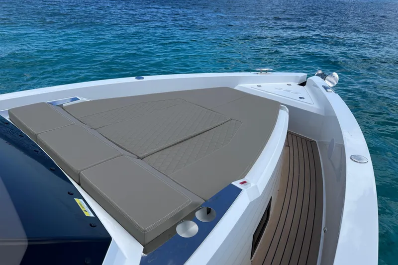 2025 Day 36 @ Cancun Yacht Photos Pics 2025 De Antonio Yachts D36 with sleek deck design on tranquil blue water.