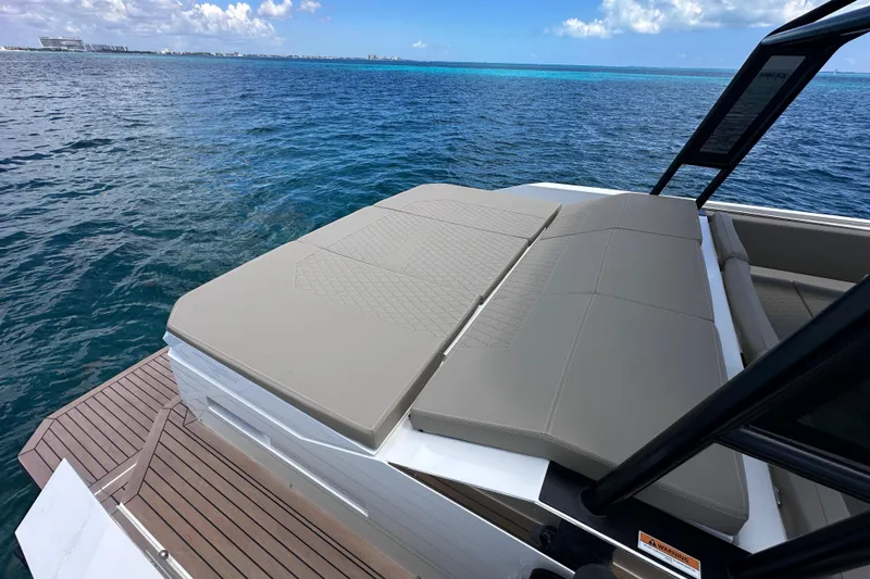 2025 Day 36 @ Cancun Yacht Photos Pics 2025 De Antonio Yachts D36 with spacious sun deck, overlooking serene ocean waters.