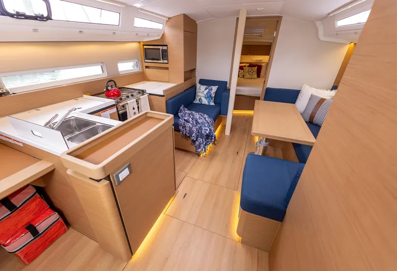  Yacht Photos Pics Interior of 2020 Jeanneau Sun Odyssey 410 yacht with modern kitchen and seating area.