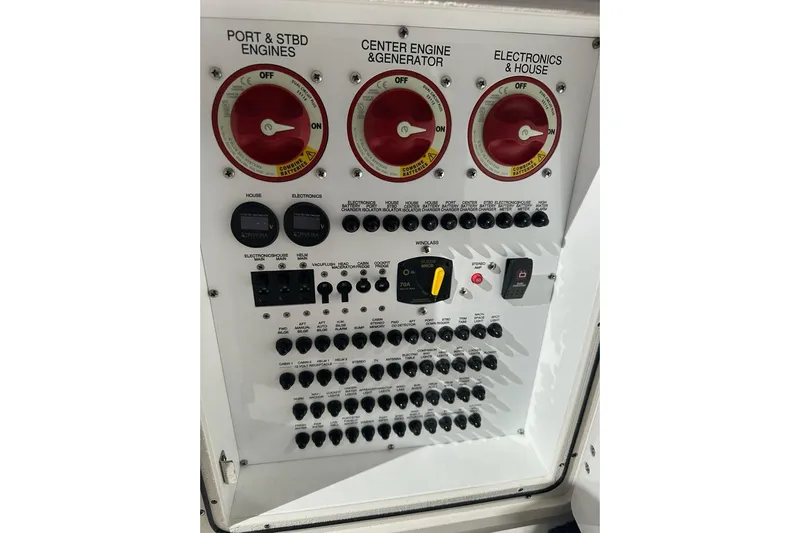Wave Paver Yacht Photos Pics Control panel of a 2020 Pursuit OS 355 Offshore boat with engine switches.