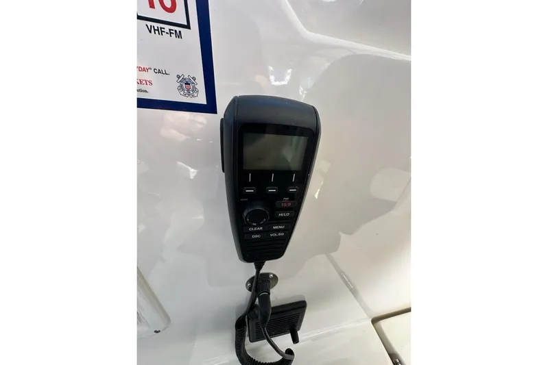 Wave Paver Yacht Photos Pics VHF radio on 2020 Pursuit OS 355 Offshore boat, mounted on white panel.