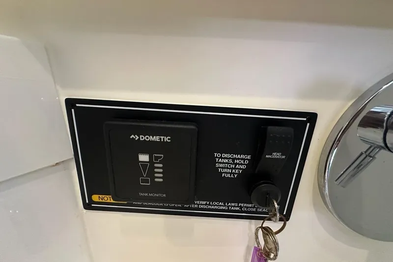 Wave Paver Yacht Photos Pics Control panel of a 2020 Pursuit OS 355 Offshore boat with Dometic tank monitor.