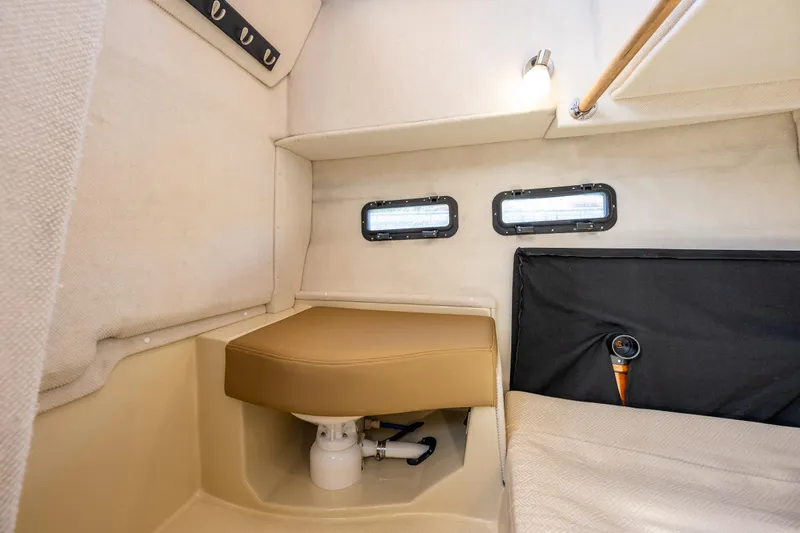 Salty Bliss Yacht Photos Pics Interior cabin of 2021 Ranger Tugs R-31 CB with seating and portholes.