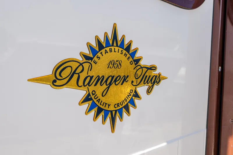 Salty Bliss Yacht Photos Pics Ranger Tugs logo on 2021 R-31 CB boat, emphasizing quality cruising since 1958.
