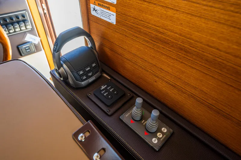 Salty Bliss Yacht Photos Pics Control panel of 2021 Ranger Tugs R-31 CB with joystick and throttle controls.