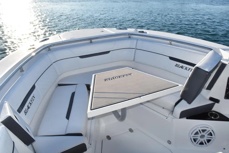  Yacht Photos Pics Luxurious seating area on 2022 Blackfin 272 CC boat, featuring elegant design and ocean view.
