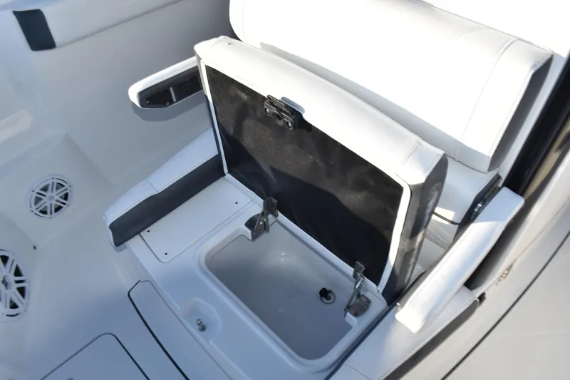  Yacht Photos Pics 2022 Blackfin 272 CC boat seat with storage compartment open.