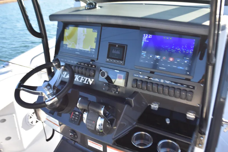  Yacht Photos Pics 2022 Blackfin 272 CC boat dashboard with navigation screens and controls.
