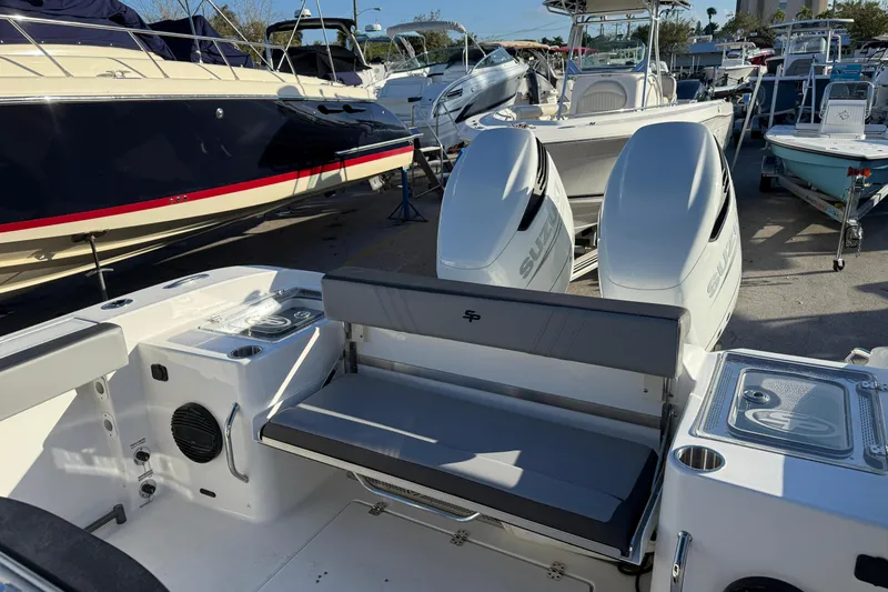  Yacht Photos Pics 2026 Sea Pro 292 DLX boat with dual engines, docked among other boats.