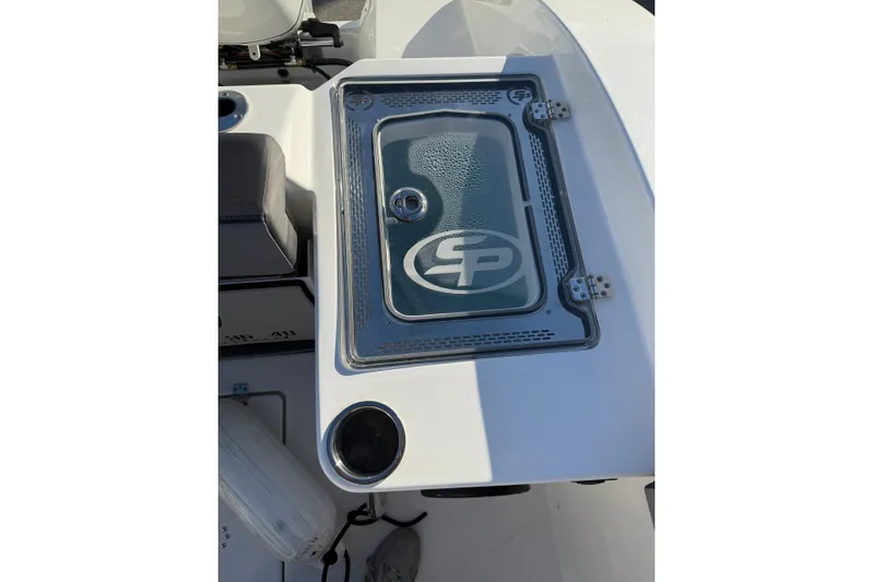  Yacht Photos Pics 2026 Sea Pro 292 DLX boat console with branded glass cover and cup holder.