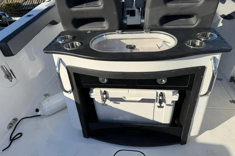  Yacht Photos Pics 2026 Sea Pro 292 DLX boat interior with seating and storage compartments.