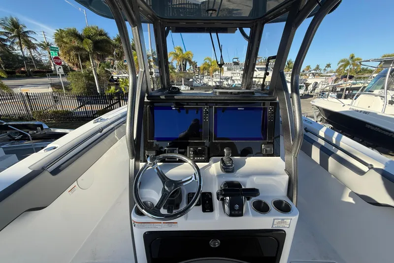  Yacht Photos Pics 2026 Sea Pro 292 DLX boat dashboard with dual screens and steering wheel.